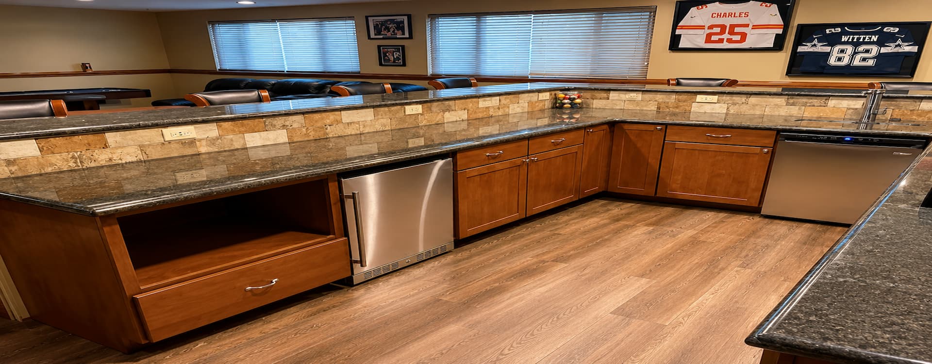 Finished basement bar and entertainment area by Jayhawk Construction
